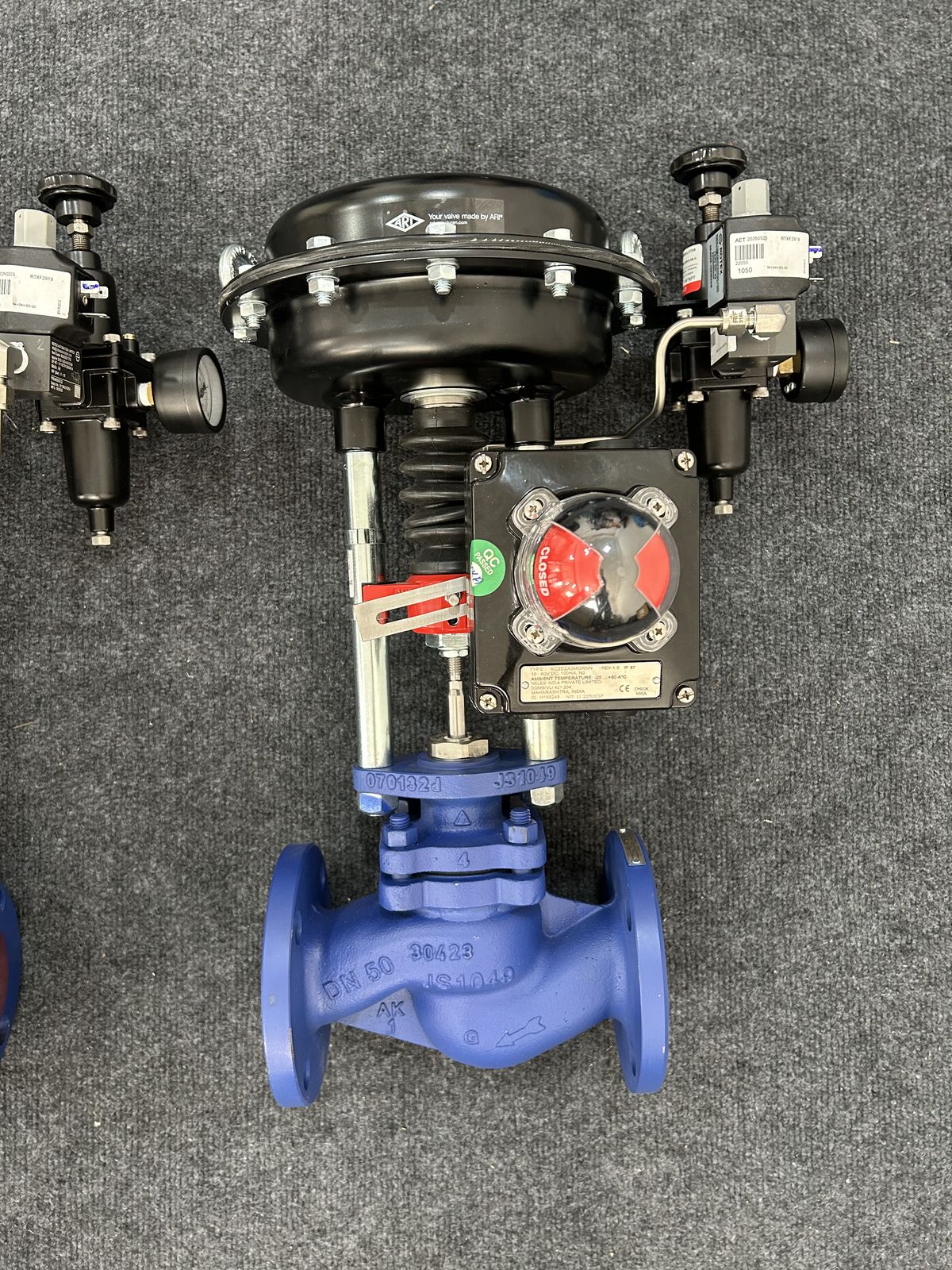 Close-up of an assembled ARI-STEVI Smart control valve with QC-passed tag, F&R and DN50 body markings