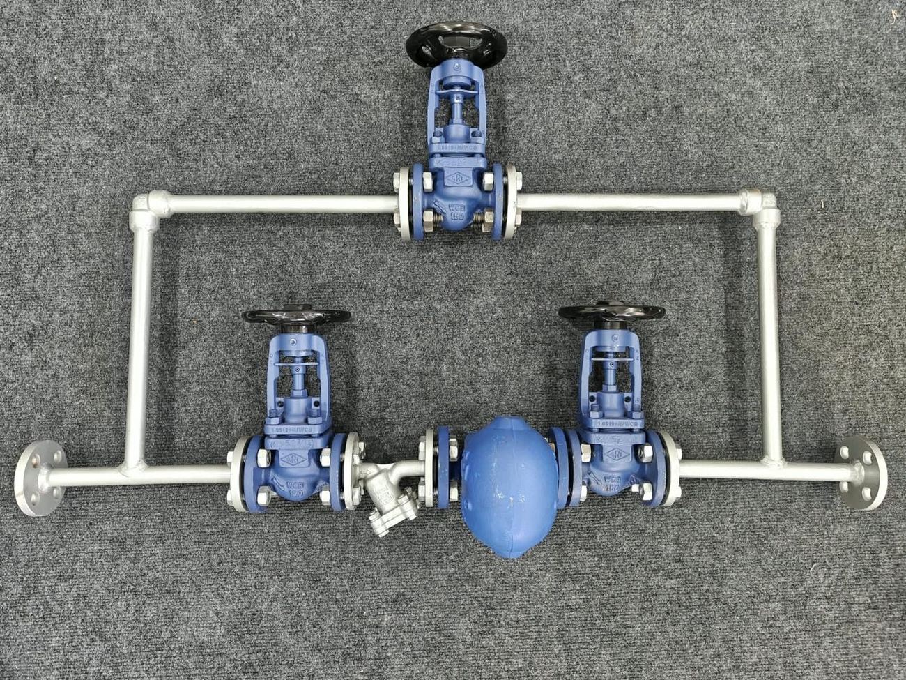 Fabricated CONA ball-float steam trap station with three ARI-FABA bellows-seal globe valves for inlet, outlet and bypass, a VALVER strainer and in-house interconnecting pipework at VALVER’s Pune facility